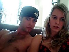 A young couple sitting on a couch