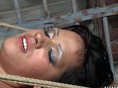 Wanton brunette doxy gets crucified by a rapacious dude who forces her suck his strain dick before he starts pinning her naked body with metal pegs and later eats her soaking twat as she lies on her back in BDSM-involved sex video by 21 Sextury.