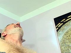 Mouth-watering brunette sexpot is riding hard stick of horny old grandpa. Then she bends over the couch lifting her ass up in the air. She gets banged bad doggy style.