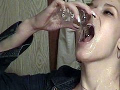 Curly-haired beauty is drinking sperm