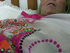 Granny Isabel gets her big tits fondled and her old pussy finger fucked by a pervert photographer. If you're into saggy tits and old pussies, don't miss this video.
