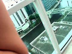 Cute brunette girlie enjoys the wonderful view from the balcony of luxurious hotel. She gets horny and lusty so she takes juicy dick in her mouth sucking it deepthroat. After giving a head she is rammed bad doggy style.