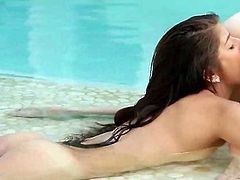 Lesbo blonde GF pussy licked from behind in the pool