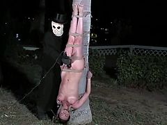 Three sexy chicks get humiliated and dominated by two guys in masks outdoors. Girls lick each others pussies and get toyed rough.