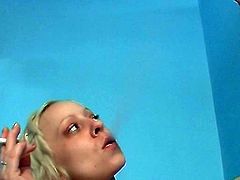 Lusty blonde goes naughty while gently sucking cock in glory hole fetish scene