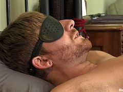 Tied on the bed's frame with rope and blindfolded, this sexy gay is having a fun experience! He's being jerked by two guys and after they've finished, rubbing his dick with vibrators, one of them, blows him. With a sex toy, deep in the ass, things are more then he can handle and soon, he ejaculates on his thigh.