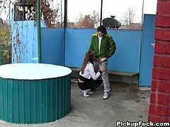 Hot brunette strolling the European streets is asked by horny guys if she'd be willing to suck cock for cash and she eagerly agrees and goes to the park bench and gets on her knees and gets down to business.