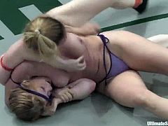 Two crazy chicks in bikini fight in a tough Ultimate Surrender battle. Darling is more lucky to win, so she sits on Madison's face and toys her vagina.