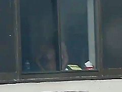 window voyeur - busty girl changing clothes