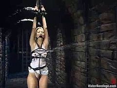 Kimberly Kane gets undressed and tied up with ropes. After that the mistress drills Kimberly's vagina deep and hard in water bondage video.