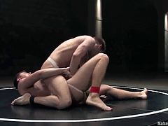 Cayden Banks and Shane Erickson in an amazing gay sex video. These oiled up dudes with muscled bodies fight on the mat. After that the losing man gets his ass fucked rough from behind.