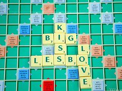 This brunette and blonde are having a game of scrabble. One of the girls puts down big kiss as a phrase and the other has to do what the board says. Before you know it there are game pieces all over the floor as they get naked.