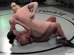 Hollie Stevens and Wenona are struggling with each other on tatami. The blonde fights the brunette down and destroys her cunt with a strapon.