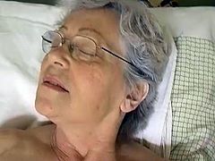 Skanky pale bodied granny takes her clothes and lies in bed. Old bitch spreads her legs wide open and starts fucking her loose snapper with dildo.