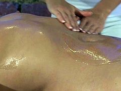 Two pretty lesbians are having some good time in massage parlour. The blonde oils her brunette GF's body and then sits down on her butt and rubs her body against it.