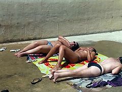 Three caught topless sunbathing