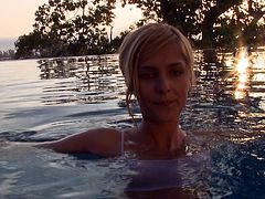This babe has swimming while her dude was recording her. She came to him and start giving nice blowjob until he cums in the pool.