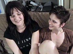 A cute brunette and her short-haired GF are having some good time in the living room. They make out and lick each other's cunts and then use dildos to satisfy each other.