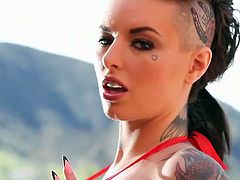 Tattooed breath taker Christy Mack in barely there red string bikini shows off her big boobs in this hot outdoor video.Watch how she shows her ass and big tits in this solo video.
