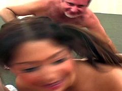 Young lusty chubby asian teen with sexy tanlines and bouncing bums plays with two dirty dudes and gets shaved twat boned deep while sucking meaty cock in threesome.