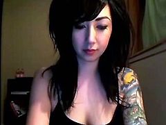 Watch this sexy tattooed brunette emo babe Evelyn's sexy bedroom webcam show.She slowly strips off her clothes and shows her sexy body and her tight pussy.