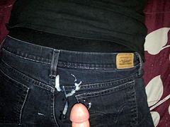 Cumshot on black jeans