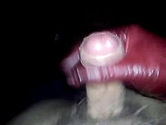 Jerking my small cock with red leather gloves.