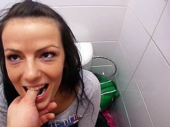 Click to watch this hot brunette showing her natural boobs and doing a great blowjob in a public bathroom. Wait to see how the guy cums over her back!