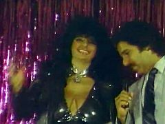 Just look how gorgeous and sexy this dark-haired enchantress is. This buxom sex goddess is in the mood for a big cock today. She gets down on her knees and gives this stud one hell of a blowjob.