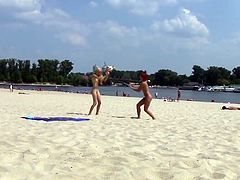 Hot teen nudists play at beach.