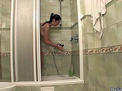 Dad played at the control panel but he knew what he's doing. The old man turned off the hot water in order to take out his sons gf out from the shower. The sexy brunette stopped showering and came at him complaining about the cold water. He gave her something hot to warm her up, a few pussy lick!