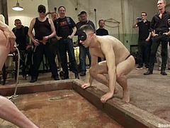 Get excited watching these homosexuals torturing and mistreating each other, especially to this particular guy who is chained and can't move.