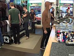 Spencer Reed, Kevin Case and a lot of other gays are having BDSM fun in a shop. The brunette twink allows his buddies to tie him up and humiliate him and then gets his mouth fucked deep.