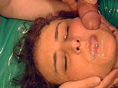 Curly-haired chick is swallowing juicy sperm
