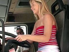 Sexy blonde bombshell Alison Angel shows off her great tits when she pulls down her top while learning to drive a truck.
