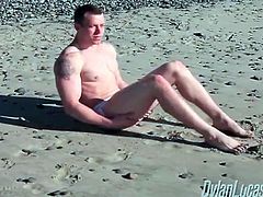 Solo muscular guy in jockstrap on the beach