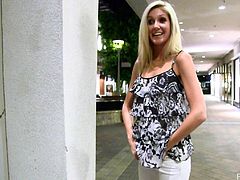 Sexy blonde babe has a date with some guy. This dude has an expensive sport car. She gets into this car and takes a blouse off to show her tits.