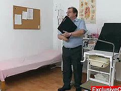 A redhead chick passes a medical examination. She has to take off her clothes. A doctor shoves some devices in her vagina and ass.