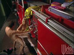 This sexy MILF took one look at the fireman and knew she wanted a piece of that. He ended up fucking her all over the fire engine.