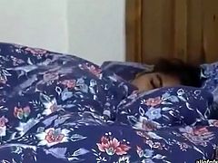 Cute Indian teen lies half naked on a bed. She keeps her legs wide open exposing her pussy on camera. Then she rubs her pussy with fingers. Exciting solo masturbation video presented by The Indian Porn.
