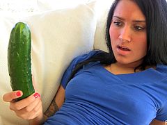 Giselle is a hot solo model. This girl poses for a camera just in a t-shirt, so she shows her perfect ass and smooth pussy. Giselle uses a long cucumber as a dildo. She shoves it as deep as she can.
