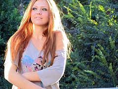 Press play to watch this glamorous redhead, with a nice ass wearing high heels, while she strips and touches herself in an erotic way.