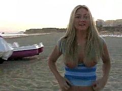 Share this with your friends! Watch this blonde doll, with natural breasts wearing black pants, while she strips outdoors and plays with your mind.