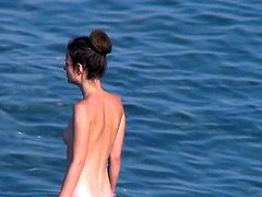 Its a real thrill to watch nude babes enjoying the sun by the beach