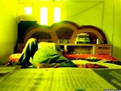 Slutty and filthy dark haired bitch with nice ass and sexy dark haired guy lays on the bed with his girl. Have a look in steamy The Indian Porn sex clip.