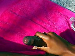 Long haired slender black shemale Tamenka with small perky titties and tight ass gets horny in the pool and starts playing with long meaty sausage while neighbor films her.