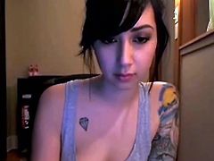 Sexy Evelyn is chatting on her webcam when she peels off her tank top and shows off her amazing, perky tits to everyone watching.