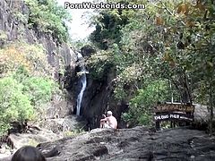 This couple takes a journey to a waterfall where they swim during the day. When the night comes, they do kinky stuff like fucking her doggy style on a chair.