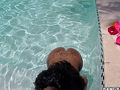 This black beauty gets in the water and splashes around for our amusement. It looks like she is having a lot of fun. That ass shakes gloriously. Her man grabs that booty and spanks it hard. Now she's horny, so she wants to suck his big, throbbing black pecker. She sucks him until he's about to cum.