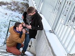 They don't mind the cold as these two guys heat things up by dropping their pants and fucking on a public staircase during a snow storm.